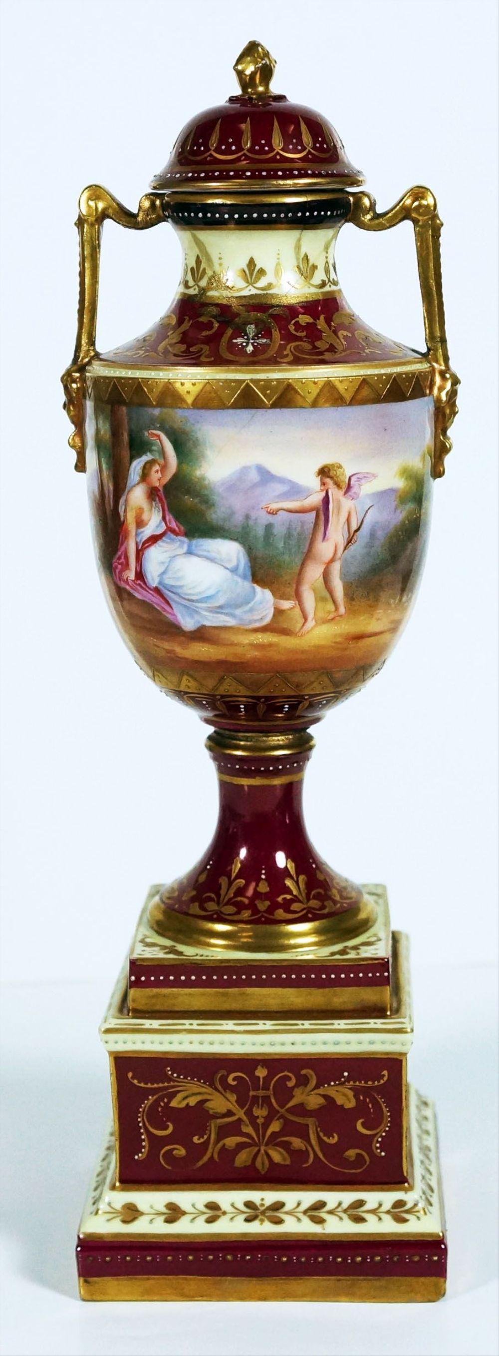 Royal Vienna Crimson And Gold Urn With Courtship Scene: 13" H 4" W 3" D Du Paquier began producing Viennese porcelain by 1718, making Vienna the second-oldest manufacturer of hard-paste porcelain in Europe. In 1744, facing financial difficulties, du Paquie