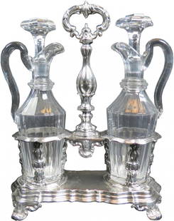 French Sterling & Cut Crystal Oil & Vinegar Set: hallmarked, footed stand with center handle, 12" tall, 526 grams with pair of original cut crystal 9 1/2" cruets, with stoppers, all excellent, late 19th century.