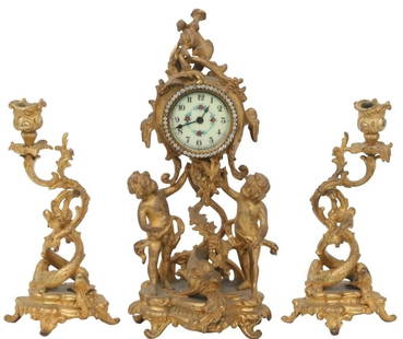 Three-Piece Figural Clock Garniture: 7\\\" L14.5\\\"" H5\\\"" WBeveled glass mirror with pierced floral rococo scrolls."