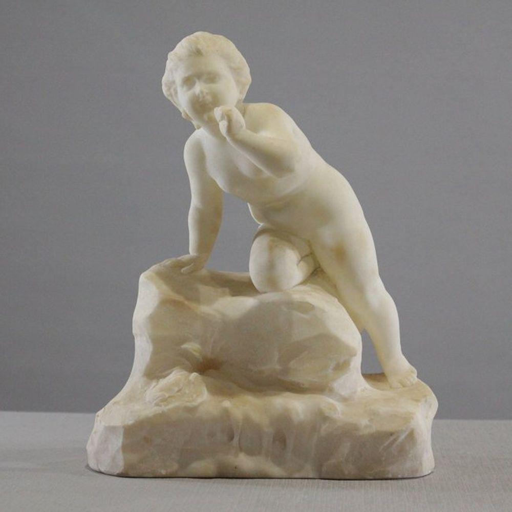 Antique 19Th C Carved Alabaster Child On Rock Sculpture: Antique 19th C Carved Alabaster Child on Rock Sculpture. Size: 12.5 in. tall, 10 in. wide.