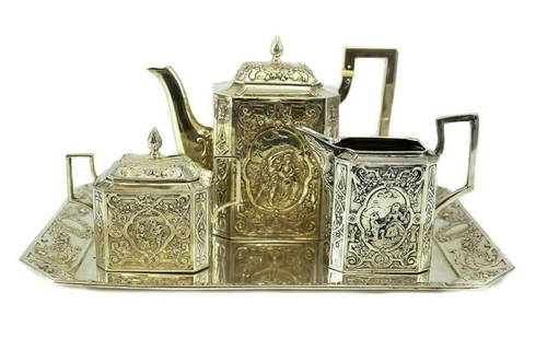 German Hand Chased Angkor .900 Silver Tea Service Set: 19th Century German Hand Chaised Angkor.900 Silver Tea Set Set 31toz. Features beautiful hand chased and chisel idyllic scenes and floral design. It consists of teapot, sugar bowl & creamer. Mark Mark