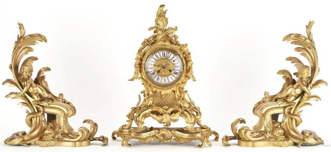 19th C. Pair Louis XV Style Bronze Chenets & French Rococo Style Bronze Clock: Pair Louis XV Style Bronze Chenets & French Rococo Style Bronze Clock Pair of Louis XV-style gilt bronze fireplace andirons or chenets featuring cherubs resting scrolls atop dolphin bases 19" H x 15 1