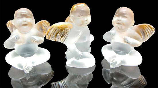 3pc Lalique Frosted Crystal Figurines, Elton John Cherubs: 3pc Lalique Frosted Crystal Figurines, Elton John Cherubs Gold edition #2248 Figures have gilding on the head and wings Lalique etched mark on bottom Largest piece: 2.25" L x 2" W x 3" H Manufacturer: