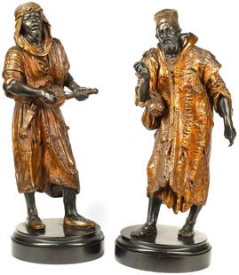 A pair of Austrian Viena Enamel cold painted metal figures: A pair of Austrian Viena Enamel cold-painted metal figures 20th century Raised on ebonized turned plinths height 29 1/2in (75cm); width of base 11 1/2in (29cm) diameter