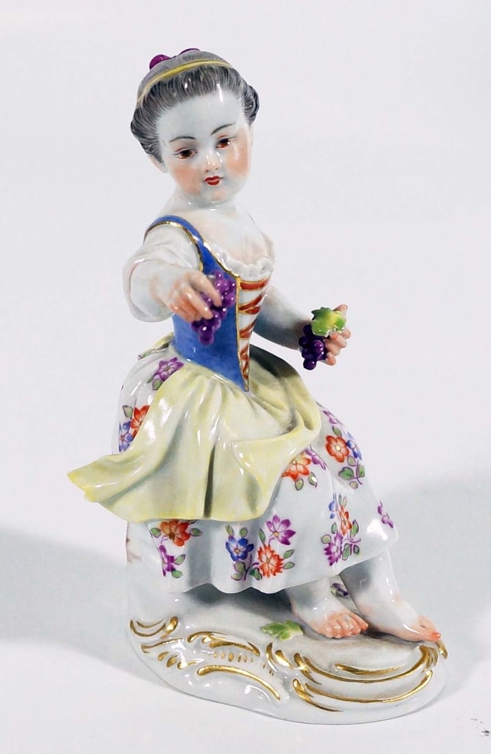 Meissen Porcelain Figure Of Girl With Grapes: 5" H Meissen porcelain or Meissen china was the first European hard-paste porcelain. Early experiments were done in 1708 by Ehrenfried Walther von Tschirnhaus. After his death that October, Johann Fri
