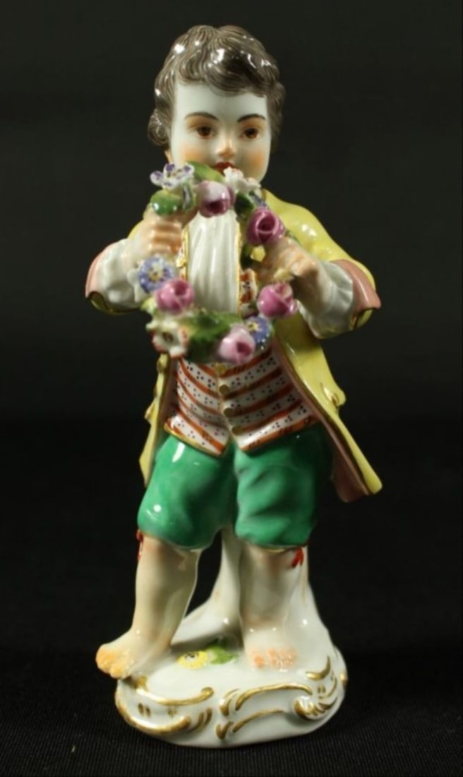 Meissen Figure Of Cherub With Reef And Flowers: Meissen Figure Of Cherub With Reef And Flowers. Measures H 5" Meissen porcelain or Meissen china was the first European hard-paste porcelain. Early experiments were done in 1708 by Ehrenfried Walther 