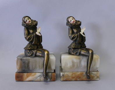 PAIR OF ART DECO BRONZE AND IVORINE BOOKENDS: PAIR OF ART DECO BRONZE AND IVORINE BOOKENDS. MEASURES H: 6 1/4" W: 3 1/4"