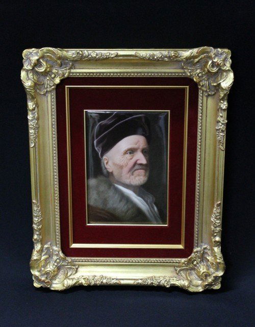 KPM PLAQUE Finely painted with a bust-length portr: KPM PLAQUE Finely painted with a bust-length portrait of an elderly gentleman wearing a fur trimmed coat and purple felt hat, after Balthazar Denner. PLAQUE: H:9 1/4" W:6 1/4"