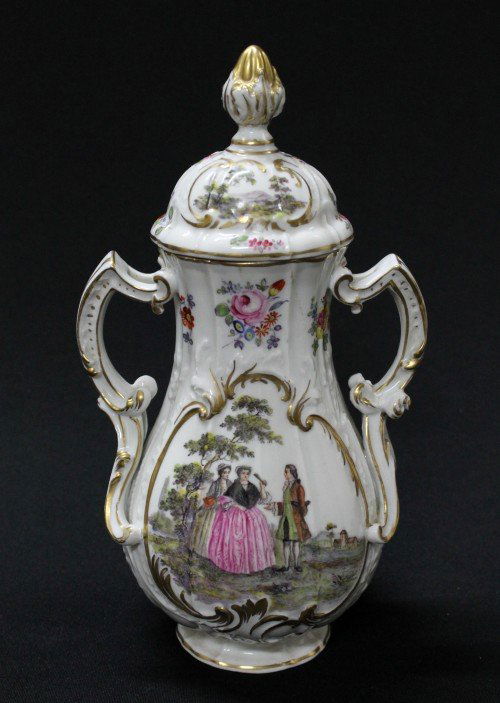 MEISSEN STYLE JAR AND COVERS WITH double handles: MEISSEN STYLE JAR AND COVERS WITH double handles, cartouche of gentleman and 2 ladies, scenic view with ruins on reverse and lid, blue crossed sword mark, 9.5"h (hairline to base of one handle)