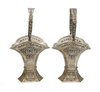 Pair German 800 Silver Decorative Pierced Baskets: Pair German 800 silver pierced baskets, circa 1900. Hand chased cherubs to the either sides of the basket. Marked 800 silver to the base. Weight Approx., 19.45 ozt Measures Approx., 6 inches x 5