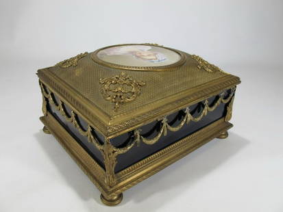 Antique French Bronze With A Painting Jewelry Box: Antique French bronze & porcelain with a painting signed by Rochette jewelry box. 4 1/4” H x 7 3/4” W x 6 3/4” D.