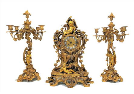 Gilt Bronze Garniture Louis Xv Style: beautiful gilt bronze garniture style Louis XV, attributed to Henri Picard. This impressive set of watches consists of a large rococo golden bronze mantle style clock and a pair of five-enlightened ch