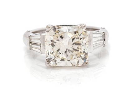 A White Gold And Diamond Ring, 3.80 Dwts.: A White Gold And Diamond Ring, Containing One Cut-Cornered Rectangular Modified Brilliant Cut Diamond Weighing 4.55 Carats And Four Tapered Baguette Cut Diamonds Weighing Approximately 0.60 Carat
