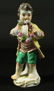 Meissen Figure Of Cherub With Reef And Flowers: Meissen Figure Of Cherub With Reef And Flowers. Measures H 5" Meissen porcelain or Meissen china was the first European hard-paste porcelain. Early experiments were done in 1708 by Ehrenfried Walther
