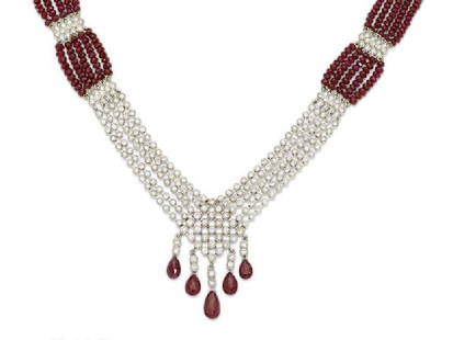 A Composite Ruby, Diamond And White Gold Necklace: A Composite Ruby, Diamond And White Gold Necklace. A Composite Ruby, Diamond And White Gold Necklace Estimated Total Diamond Weight 7.00Cts; Length 16 1/2 In.