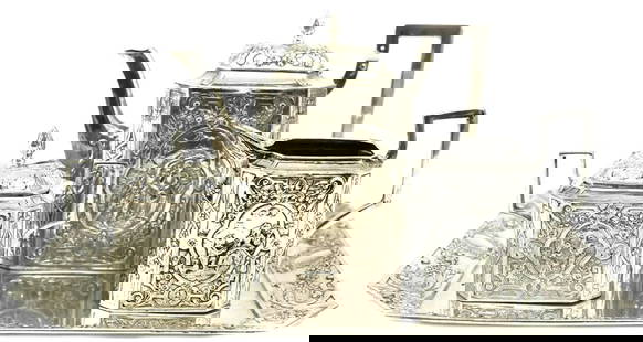 German Hand Chased Angkor .900 Silver Tea Service Set: 19th Century German Hand Chaised Angkor.900 Silver Tea Set Set 31toz. Features beautiful hand chased and chisel idyllic scenes and floral design. It consists of teapot, sugar bowl & creamer. Mark Mark
