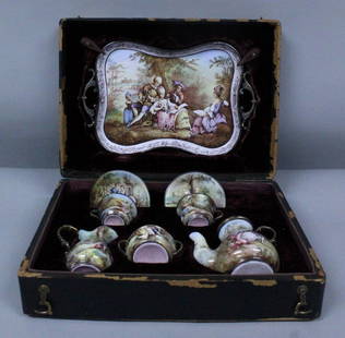 VIENNESE ENAMEL TEASET ON SILVER IN ORIGINAL BOX: VIENNESE ENAMEL TEASET ON SILVER IN ORIGINAL BOX. THE TRAY MEASURES 9" X 6", THE SAUCERS MEASURE 2 3/4" DIAMETER, THE CUPS MEASURE H: 1 1/4", THE CREAMER MEASURES H: 2 3/4", THE SUGARPOT MEASURES H: 2