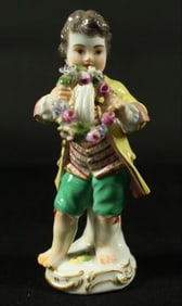 Meissen Figure Of Cherub With Reef And Flowers