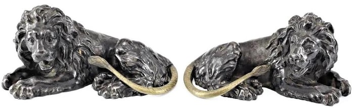 Pair of hand Painted Black Iron Lion Figurines; Posed Lying Down Circa 19th C.