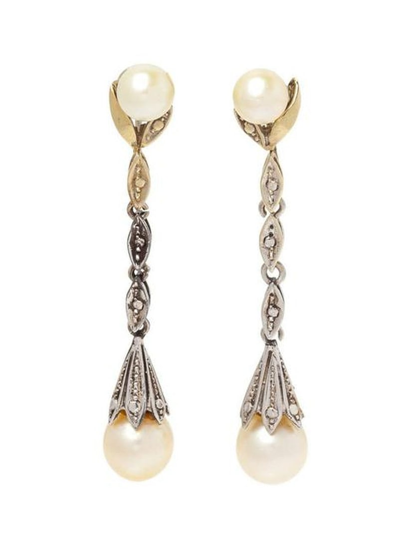 A Pair Of White Gold And Cultured Pearl Earclips,: A Pair of White Gold and Cultured Pearl Earclips, containing two pearls measuring approximately 6.00 mm and two pearls measuring approximately 7.25 mm in a drop style earring with screw earclips.