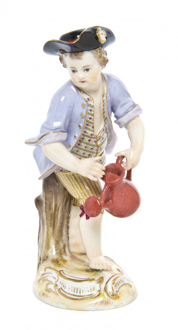 A Meissen Porcelain Figure: A Meissen Porcelain Figure, depicting a boy with a watering can, having crossed swords mark in underglaze blue, further impressed 65 and incised 18. Height 5 1/4 inches.