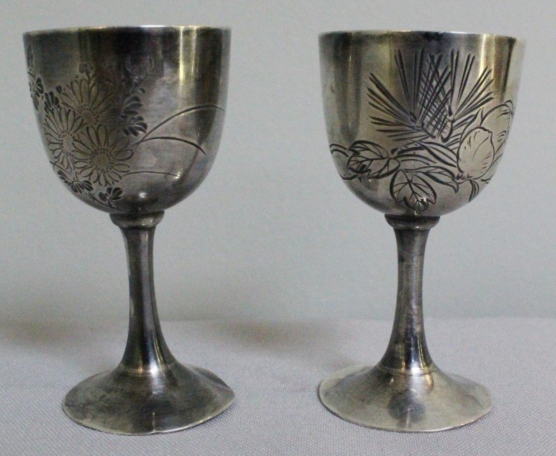 PAIR OF CHINESE SILVER SHOT GLASSES: PAIR OF CHINESE SILVER SHOT GLASSES. MEASURES H: 3"