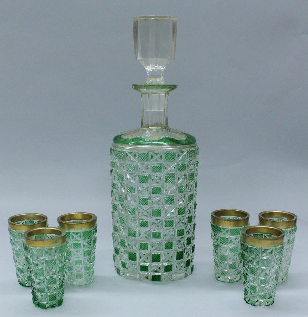 GLASS DRINKING SET: GLASS DRINKING SET. THE BOTTLE MEASURES H: 10 1/2" AND THE SHOTS MEASURE H: 2 3/4"