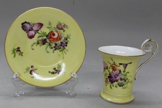 19TH C. GERMAN PORCELAIN CUP AND SAUCER: 19TH C. GERMAN PORCELAIN CUP AND SAUCER. THE CUP MEASURES H: 4" AND THE SAUCER MEASURES 5" DIAMETER