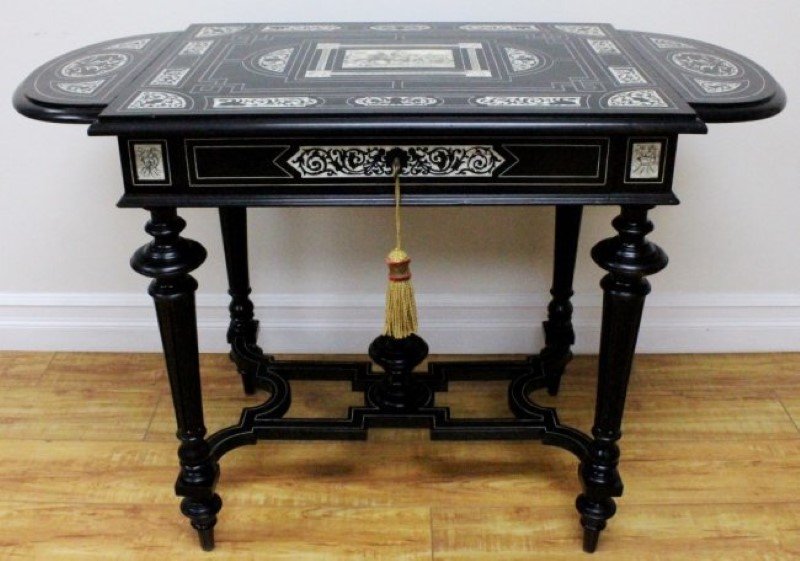 19TH C. ITALIAN EBONIZED WOOD AND IVORY INLAID TABLE: 19TH C. ITALIAN EBONIZED WOOD AND IVORY INLAID TABLE. MEASURES H: 28 1/4" W: 42"