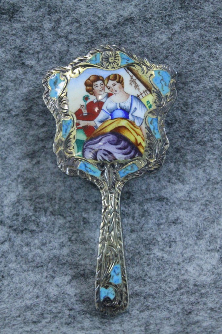POLYCHROME ENAMELLED SILVER AND METAL HAND MIRROR: POLYCHROME ENAMELLED SILVER AND METAL HAND MIRROR. MEASURES H: 4"