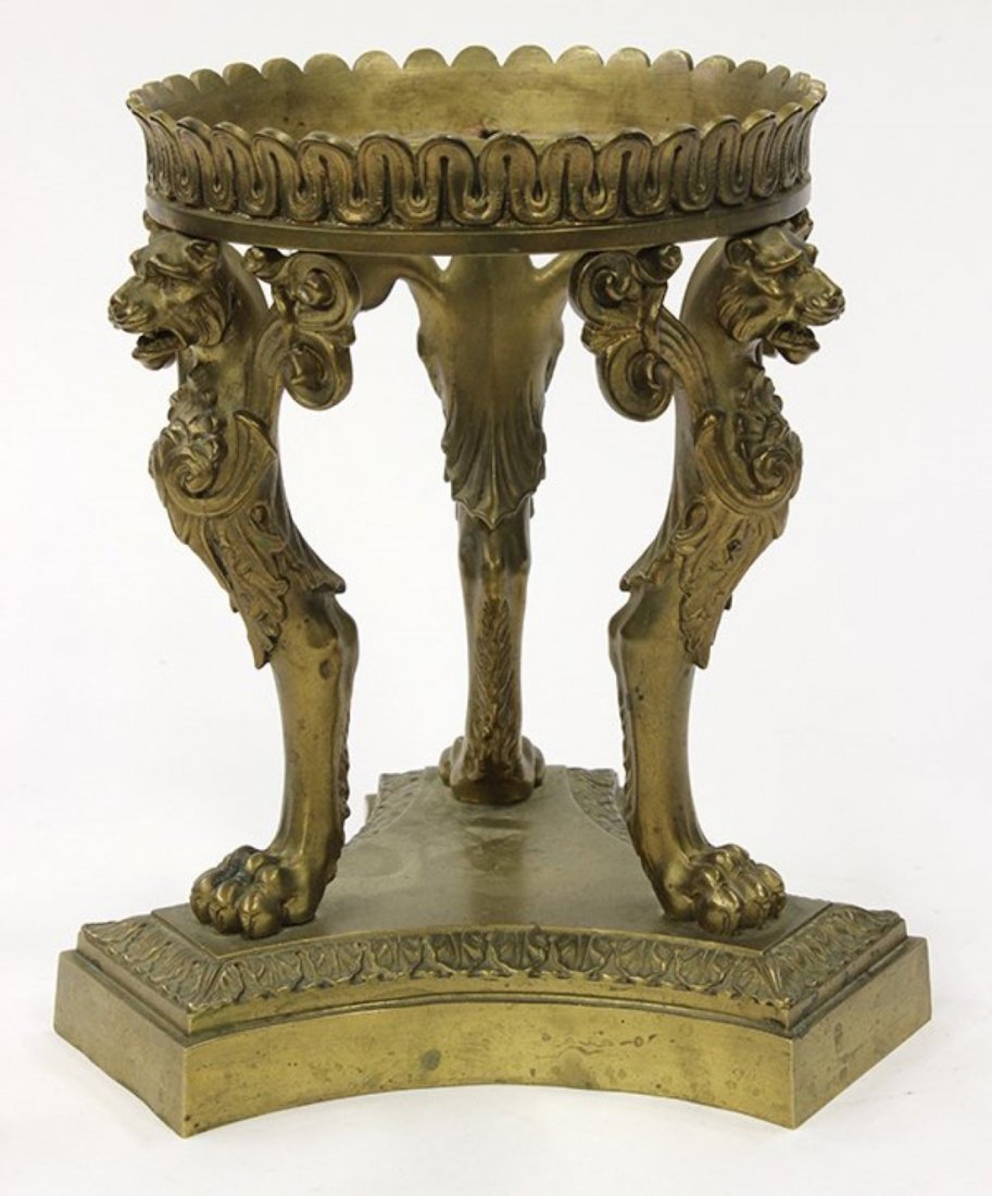 French, Louis XV style gilt metal stand: French Louis XV style patinated bronze stand, having three lion form supports rising on paw feet, terminating on a graduated base, 8.75"h