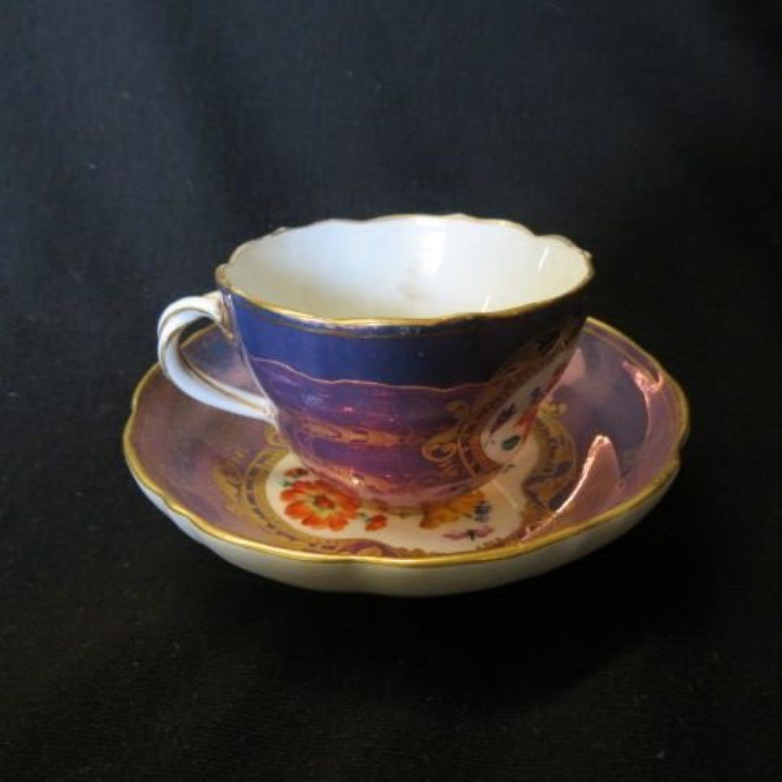 Meissen Porcelain Cup & Saucer: handpainted floral, luster finish, crossed swords mark, excellent.