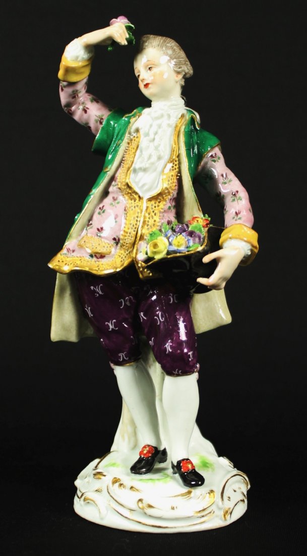 19th c. Meissen porcelain figurine: "Man with Hat of Flowers", blue cross sword mark, 1770-1910. Approx. 6.75" H.