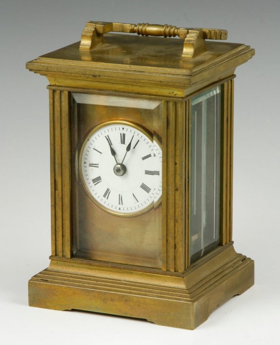 Early 20th C. Brass Carriage Clock: Early 20th century carriage clock, brass with enamel face, 7"h including handle. Operational condition unknown.