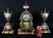 3 PC. FRENCH GILT-METAL AND PORCELAIN CLOCK GARNITURE