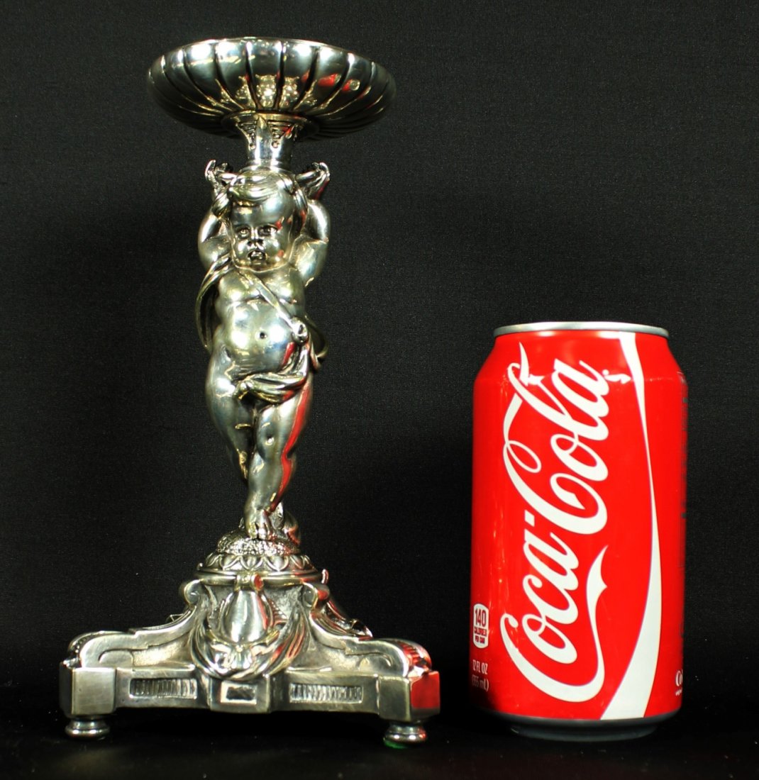 ANTIQUE ENGLISH SILVER PLATED FIGURAL CENTERPIECE: ANTIQUE ENGLISH SILVER PLATED FIGURAL CENTERPIECE. MEASURES H: 9 3/4" W: 4". TOTAL WEIGHT IS 1153 GRAMS SHIPPING AND HANDLING TO 48 STATES OF UNITED STATES: $40 INTERNATIONAL, ALASKA, HAWAII AND US PR