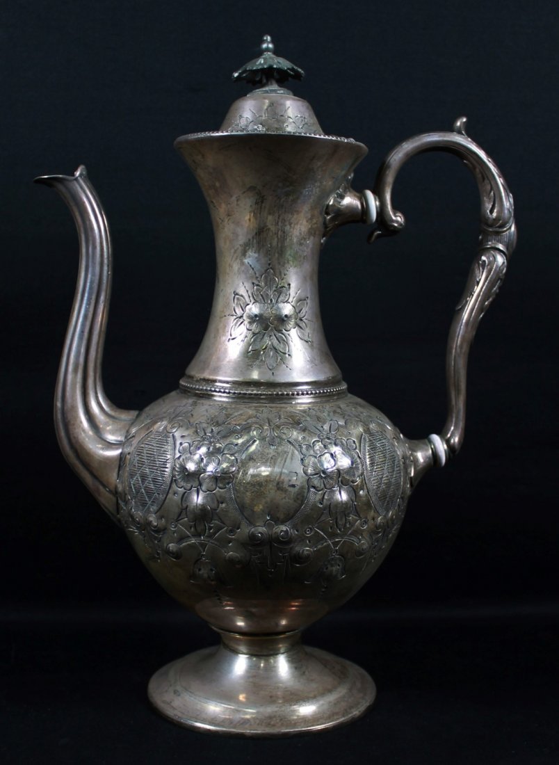 SILVER TEAPOT: SILVER TEAPOT. MEASURES H: 13" W: 9 1/2"
