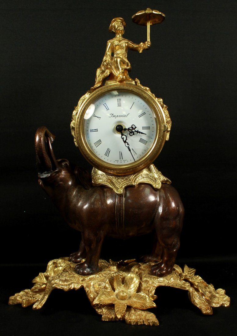 GILT METAL AND BRONZE ELEPHANT TABLE CLOCK: GILT METAL AND BRONZE ELEPHANT TABLE CLOCK. MEASURES 16" X 12"
