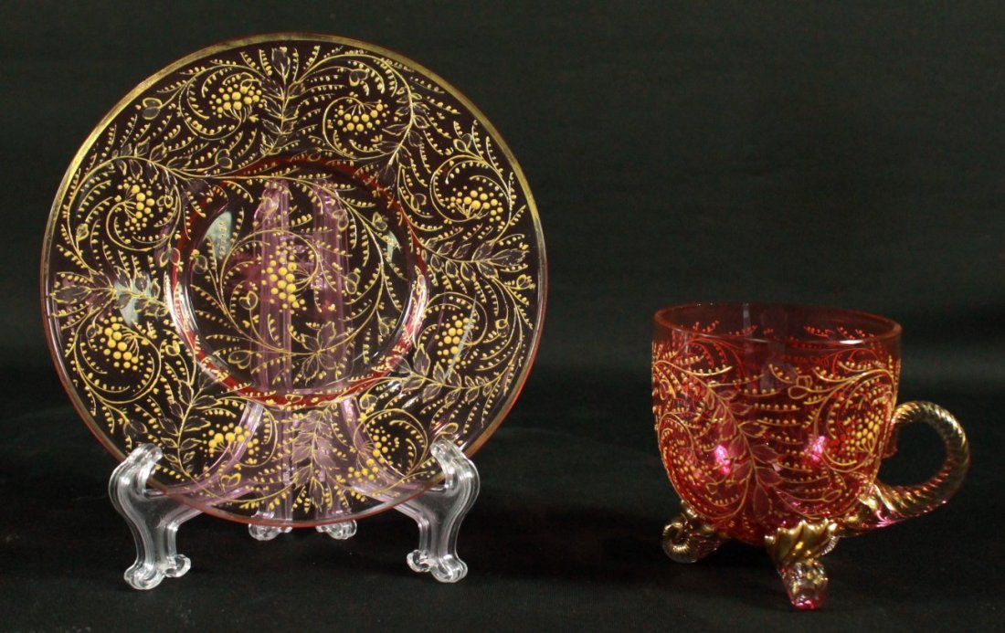 MOSER DECORATED CUP AND SAUCER: MOSER DECORATED CUP AND SAUCER. THE CUP MEASURES H: 3 3/4" AND THE SAUCER MEASURES 5 3/4" DIAMETER