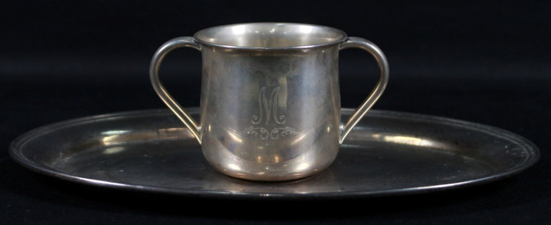 REED AND BARTON STERLING CUP AND SAUCER: REED AND BARTON STERLING CUP AND SAUCER. CUP MEASURES H: 2 1/4" AND THE SAUCER MEASURES 3 3/4" DIAMETER
