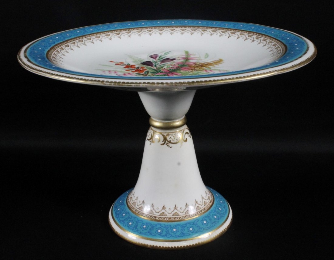ANTIQUE GERMAN PORCELAIN CAKE STAND: ANTIQUE GERMAN PORCELAIN CAKE STAND. MEASURES H: 6 1/2" W: 9 1/2"
