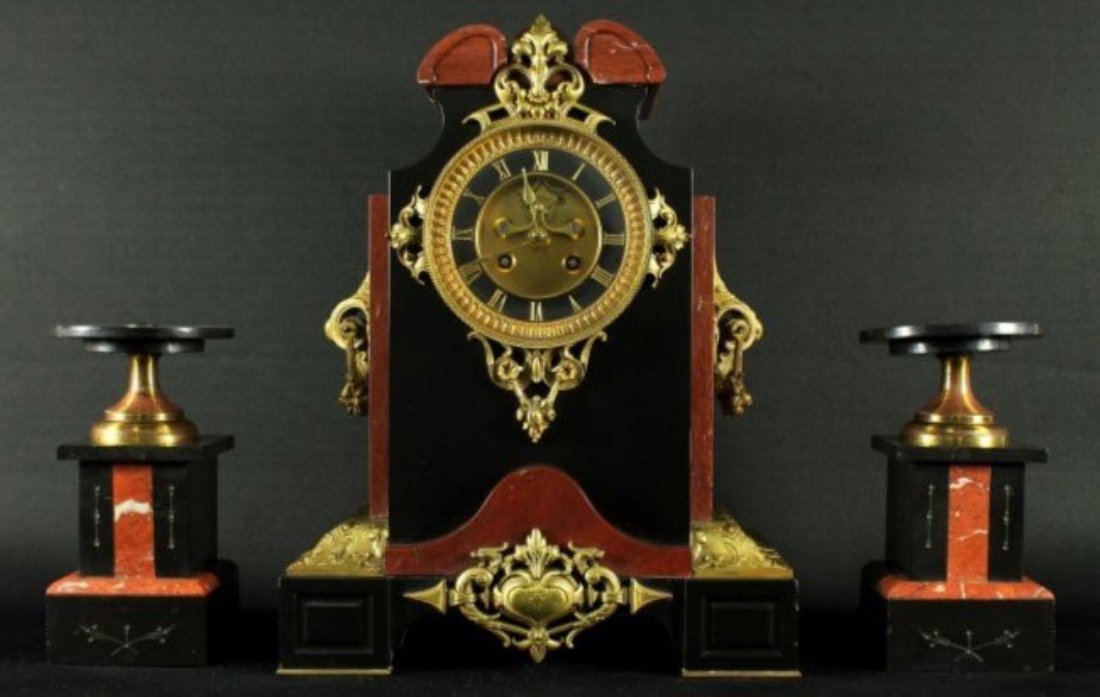 19TH C. FRENCH 3 PC. CLOCKSET: 19TH C. FRENCH 3 PC. CLOCKSET. THE CLOCK MEASURES H: 14" W: 11". THE PEDESTALS MEASURES H: 7 1/4" W: 4"
