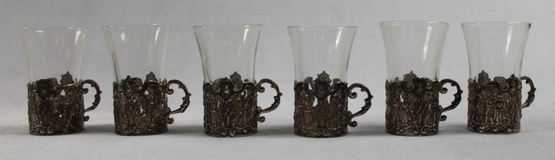 SET OF 6 STERLING SILVER CUP HOLDERS WITH GLASS INSERTS: SET OF 6 STERLING SILVER CUP HOLDERS WITH GLASS INSERTS. MEASURES H: 2 1/4" W: 2"