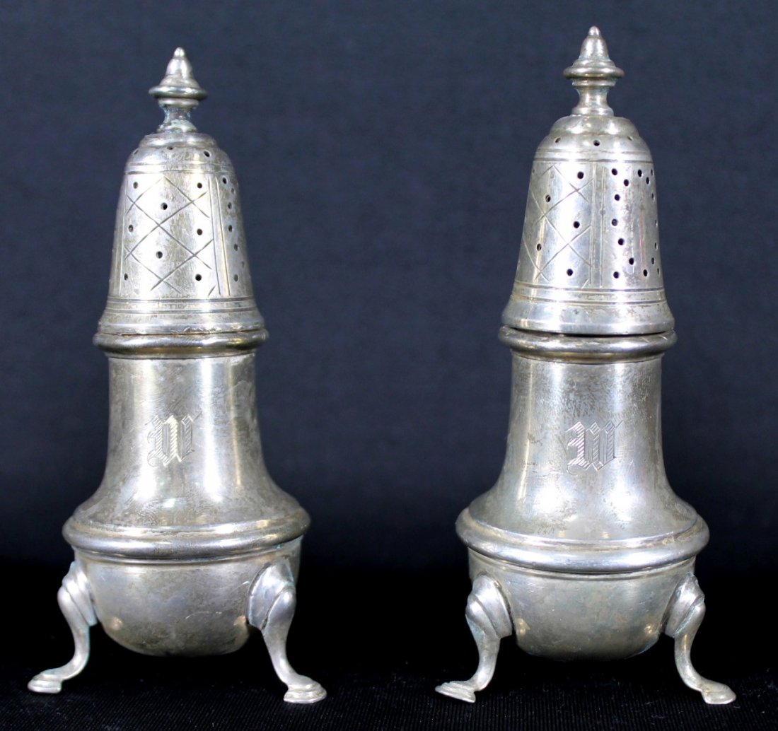 PAIR OF CARTIER STERLING SALT SHAKERS: PAIR OF CARTIER STERLING SALT SHAKERS. MEASURES H: 4 1/4" W:1 1/2" WEIGHT: 150 gram