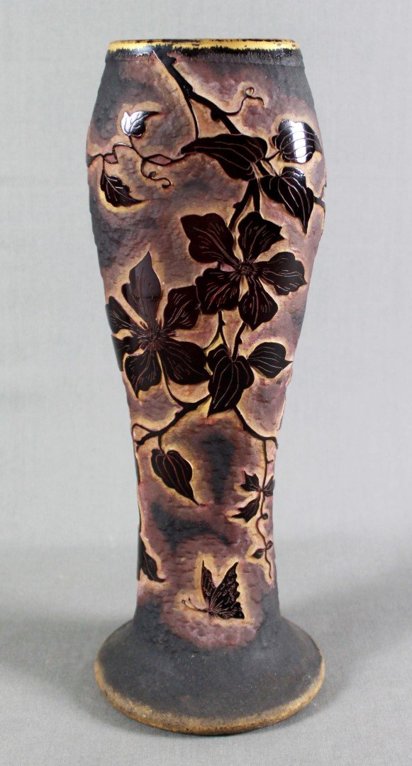 A DAUM NANCY FRENCH CAMEO GLASS FLATTENED VASE, WITH: A DAUM NANCY FRENCH CAMEO GLASS FLATTENED VASE, WITH CROSS OF LORRAINE, CIRCA 1900. the sides acid-etched in deep purple with Columbine vines and a butterfly, and with gilt highlights 12 ¼in. (31cm.)