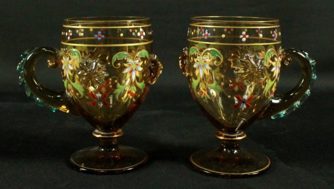 PAIR OF MOSER DECORATED CUPS WITH HANDLES: AIR OF MOSER DECORATED CUPS WITH HANDLES. MEASURES H: 4 1/4"