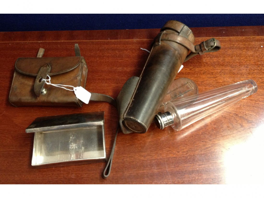 A glass hunting flask with silver plated top (DCK: A glass hunting flask with silver plated top (DCK initials to the top) together with a silver plated sandwich box, both in original leather cases.