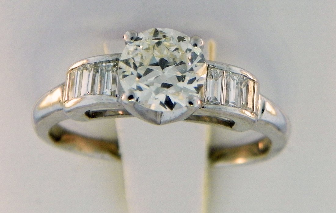 Ring: Diamond Engagement Ring ~.80ct. solitaire w/ baguettes. Total diamond weight ~1.10 ct. ~3.1dwt plat.