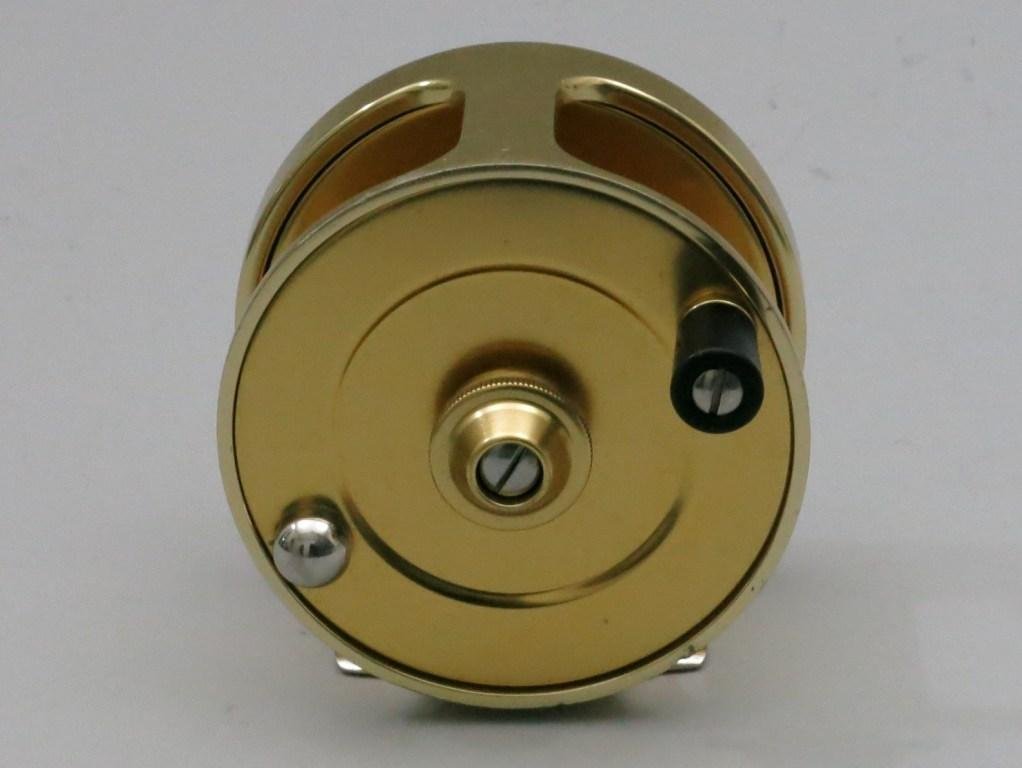 Fin-Nor No. 4 Big Game Fly Reel: 3 5/8"dia. and 1 1/2" spool width. This left hand wind model with disc drag is a second generation reel with conical back-plate engraved "Since 1933". Direct drive reel for Tarpon, Permit, and Blue wa