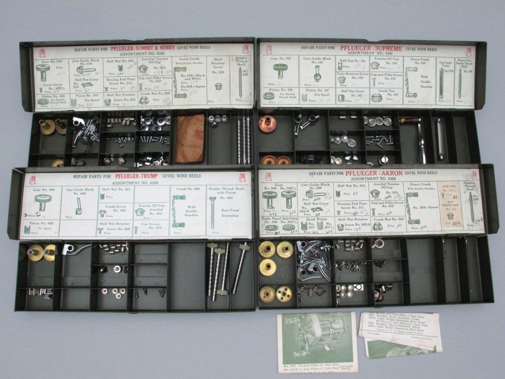 Four Different Pflueger Bait Casting Reel Repair Kits: Coming in metal 3" x 10" lidded boxes, this group includes kits for Supreme, Akron, Trump and Summit/Nobey. Although not filled, each contain ample stock with identifying labels inside the lid. All ar